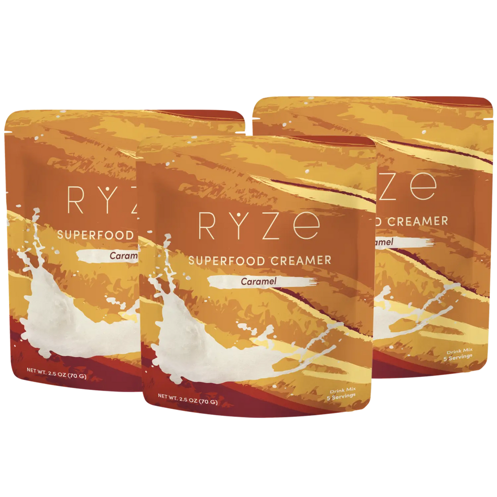 Three packages of RYZé Superfood Creamer Caramel on a white background